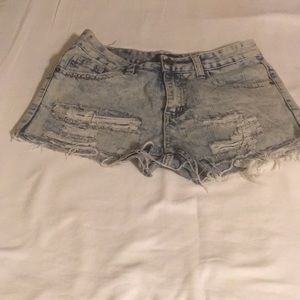 Distressed CJ Black jean shorts size 28.